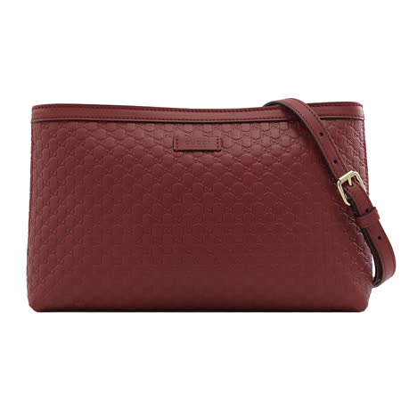 GUCCI 
壓紋小牛皮斜背扁包